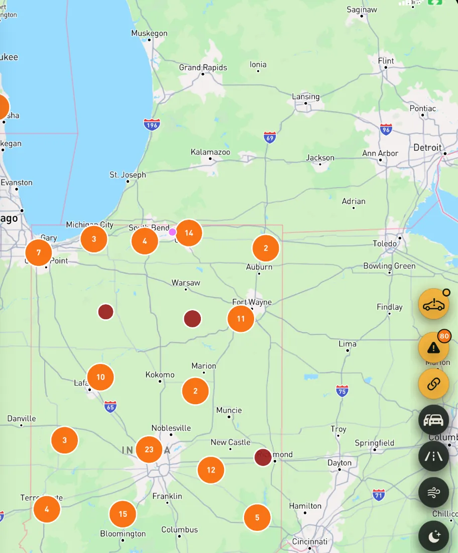 Map of Illinois and Indiana with orange clusters of road reports and red markers for single reports